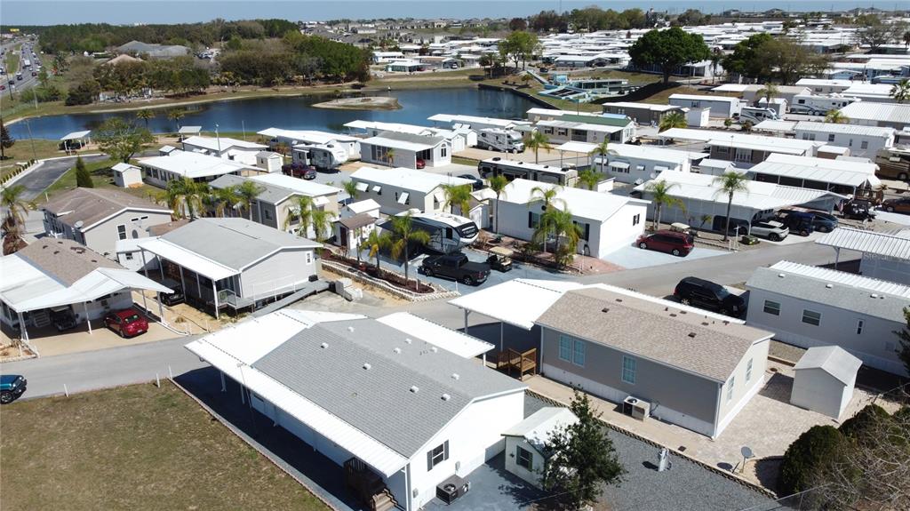 251 Patterson Road, Unit I3 Haines City, FL 33844 - Photo 33 of 38 an aerial view of a house with a lake view