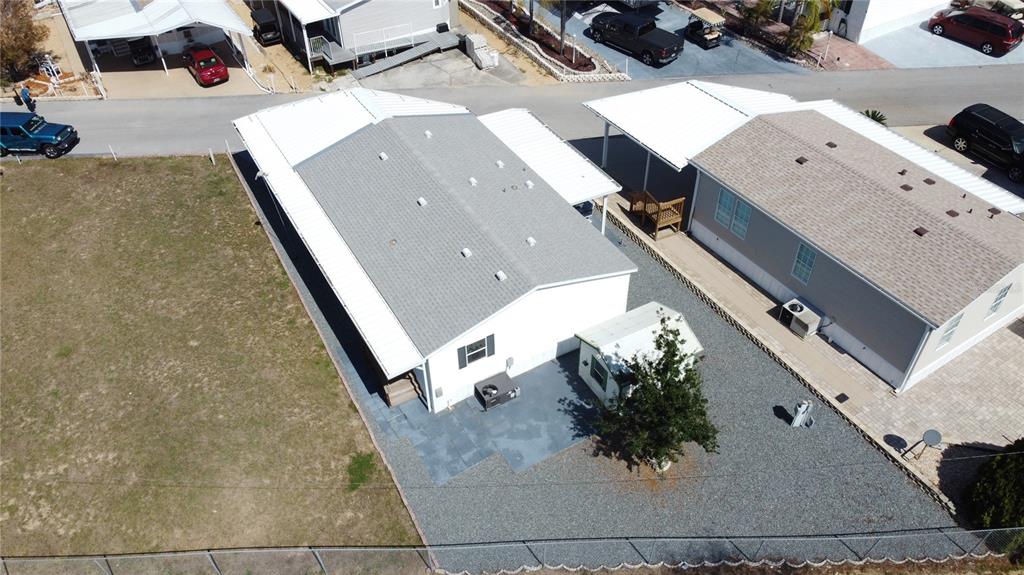 251 Patterson Road, Unit I3 Haines City, FL 33844 - Photo 34 of 38 an aerial view of a house with a yard