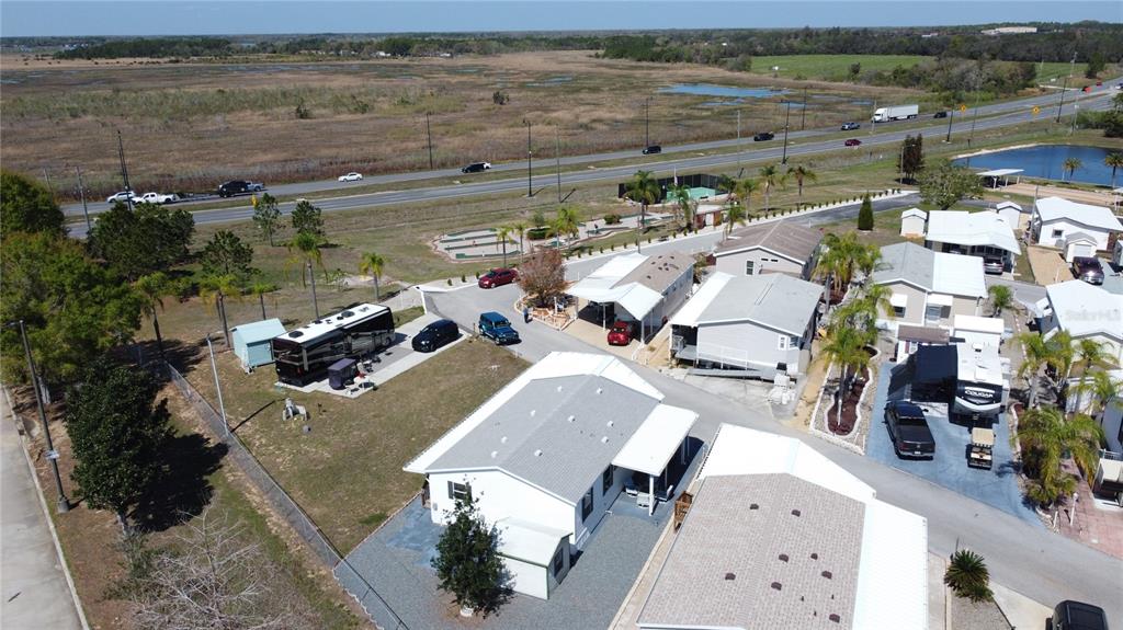 251 Patterson Road, Unit I3 Haines City, FL 33844 - Photo 35 of 38 an aerial view of a house with a lake view