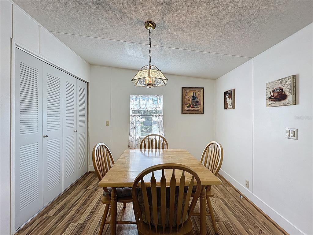251 Patterson Road, Unit I3 Haines City, FL 33844 - Photo 6 of 38 a view of a room with furniture wooden floor and window