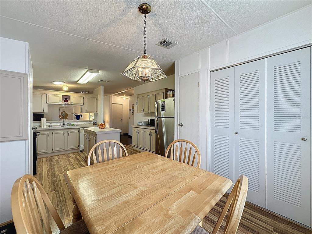 251 Patterson Road, Unit I3 Haines City, FL 33844 - Photo 8 of 38 a dining room with furniture and window