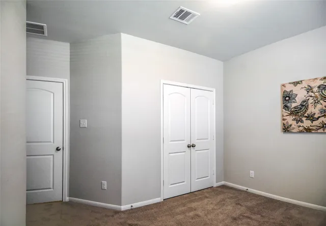 a view of a hallway with closet