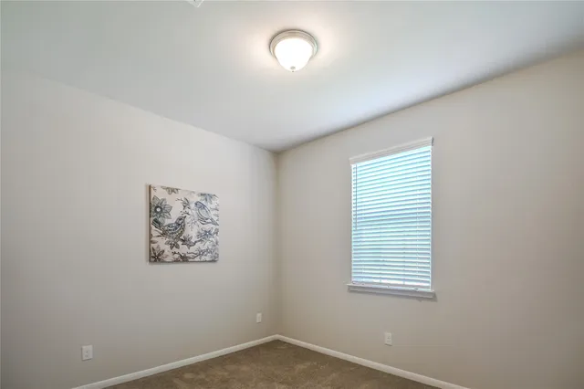 a bathroom with a granite countertop toilet a sink and shower