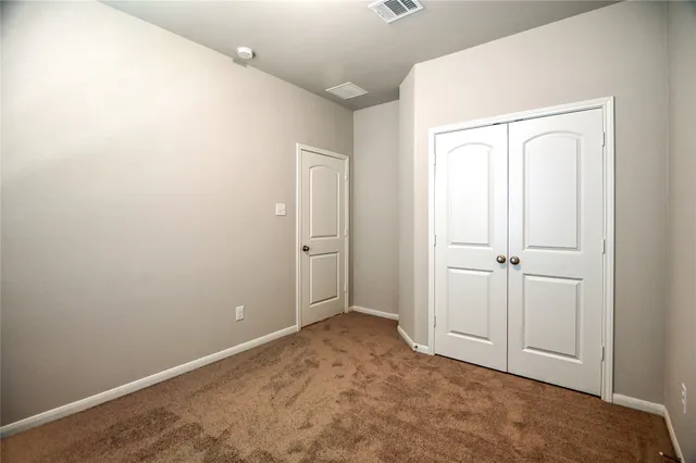 a bathroom with a shower and a sink
