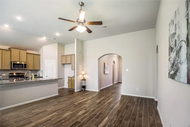 a view of a room with wooden floor