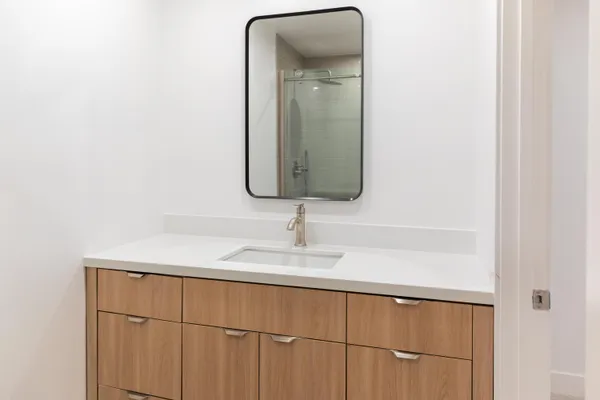 a bathroom with a sink and a mirror