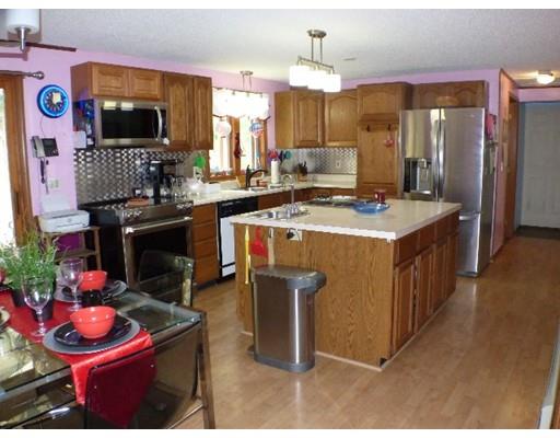 55 West Leyden Road Leyden, MA 01337 - Photo 8 of 29 a kitchen with stainless steel appliances kitchen island granite countertop a sink stove and cabinets