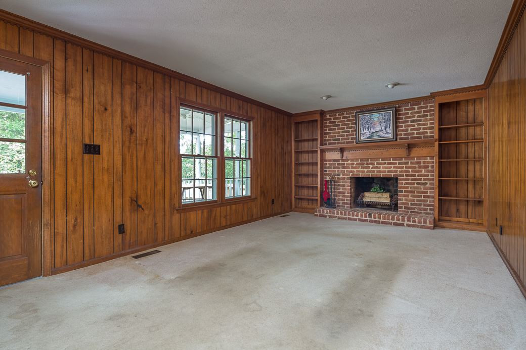 6700 Colony Court Raleigh, NC 27613 - Photo 5 of 21 Great sized family room boasts brick wood-burning fireplace. Built-in bookshelves, decorative crown molding & mantle are great features, too! Family Room