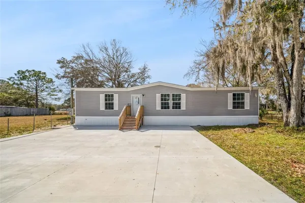 a view of a house with a patio