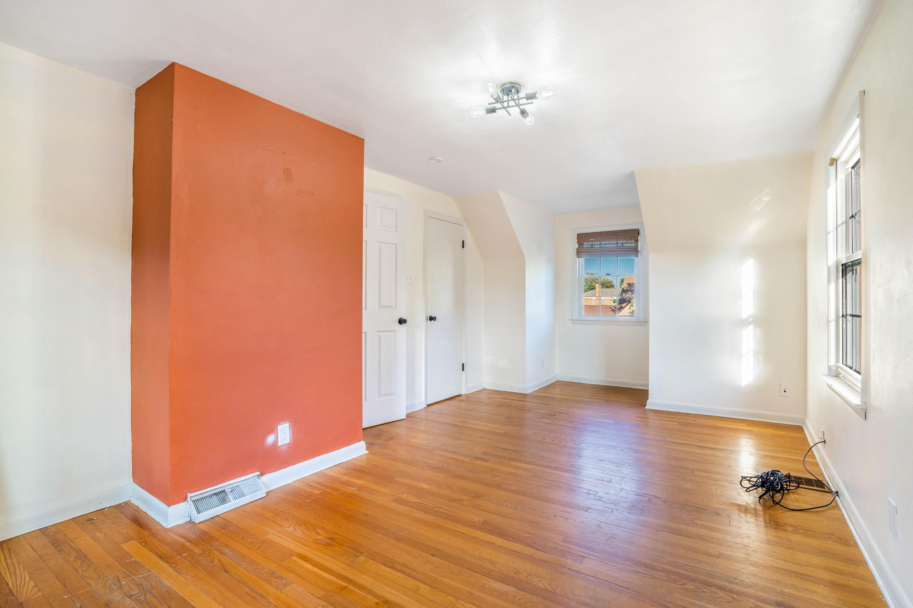 6734 Baring Avenue Hammond, IN 46324 - Photo 13 of 22 a view of an empty room with wooden floor