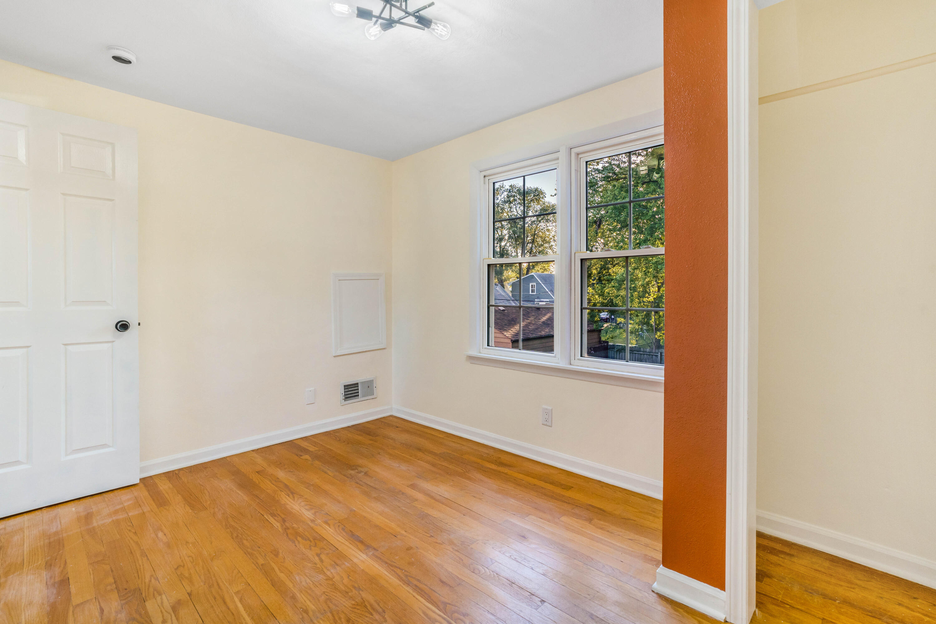 6734 Baring Avenue Hammond, IN 46324 - Photo 16 of 22 a view of empty room with wooden floor and fan