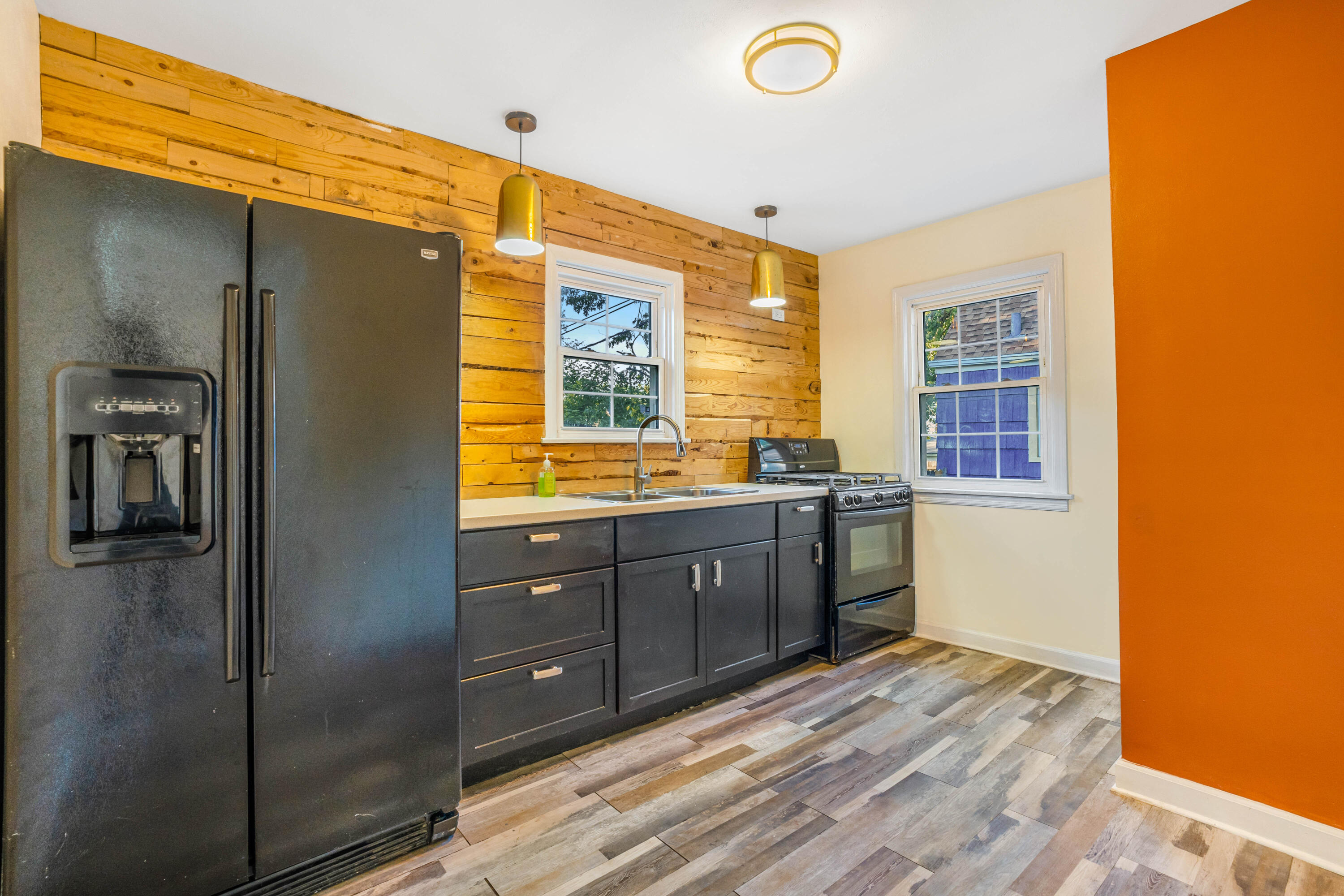 6734 Baring Avenue Hammond, IN 46324 - Photo 5 of 22 a spacious bathroom with a granite countertop sink and a bathtub