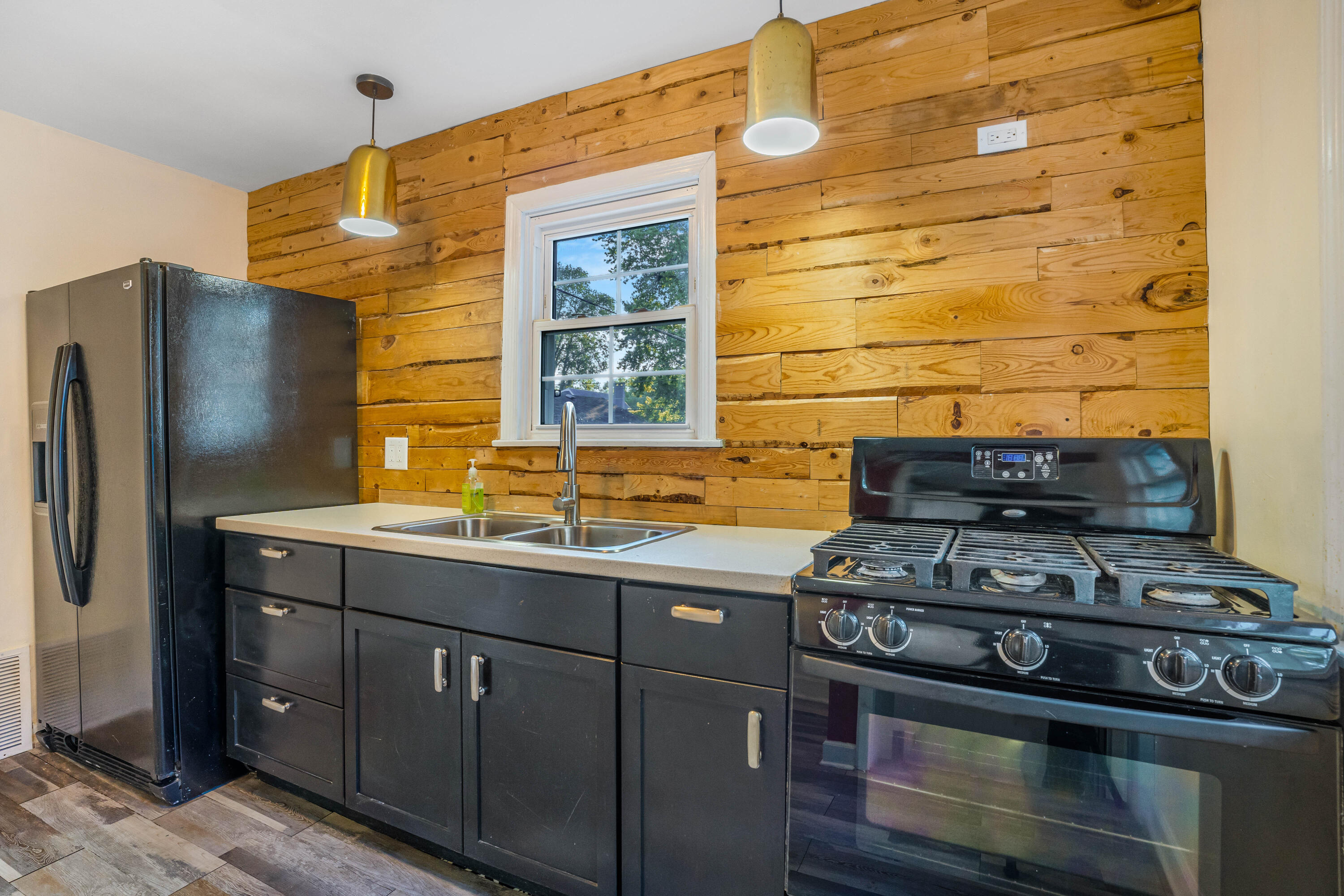 6734 Baring Avenue Hammond, IN 46324 - Photo 6 of 22 a kitchen with a stove and a refrigerator
