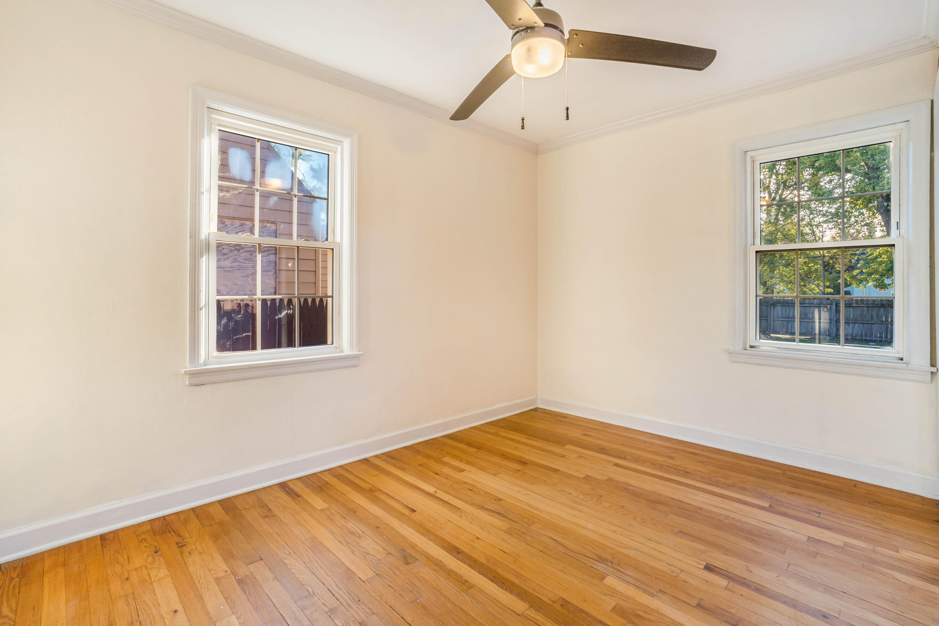6734 Baring Avenue Hammond, IN 46324 - Photo 8 of 22 a view of empty room with wooden floor and fan