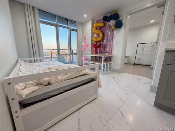 a bed room with a bed and a window