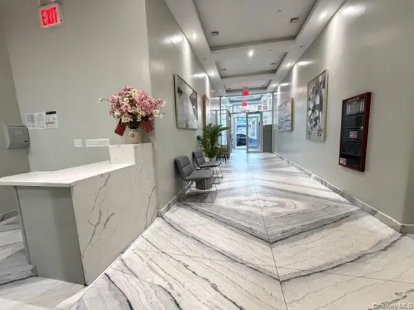 a kitchen with stainless steel appliances kitchen island a refrigerator and a sink