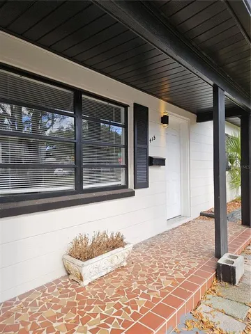 a outdoor space with sliding door and wooden floor