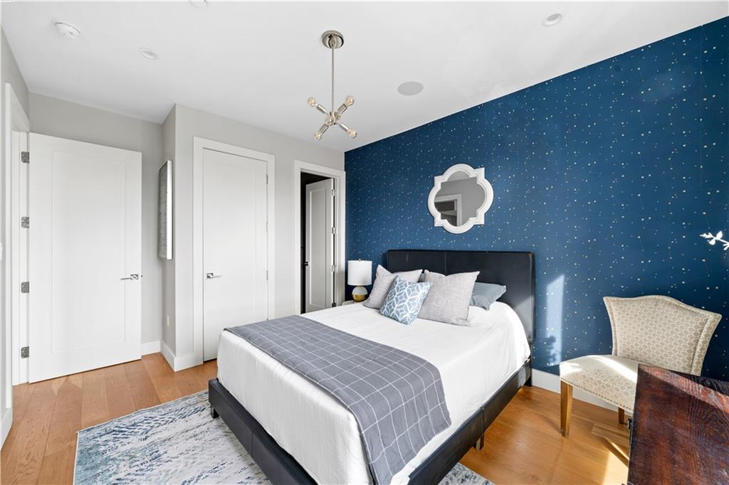 139 Grove Street, Unit 4F Brooklyn, NY 11221 - Photo 12 of 23 a bedroom with bed and a night stand