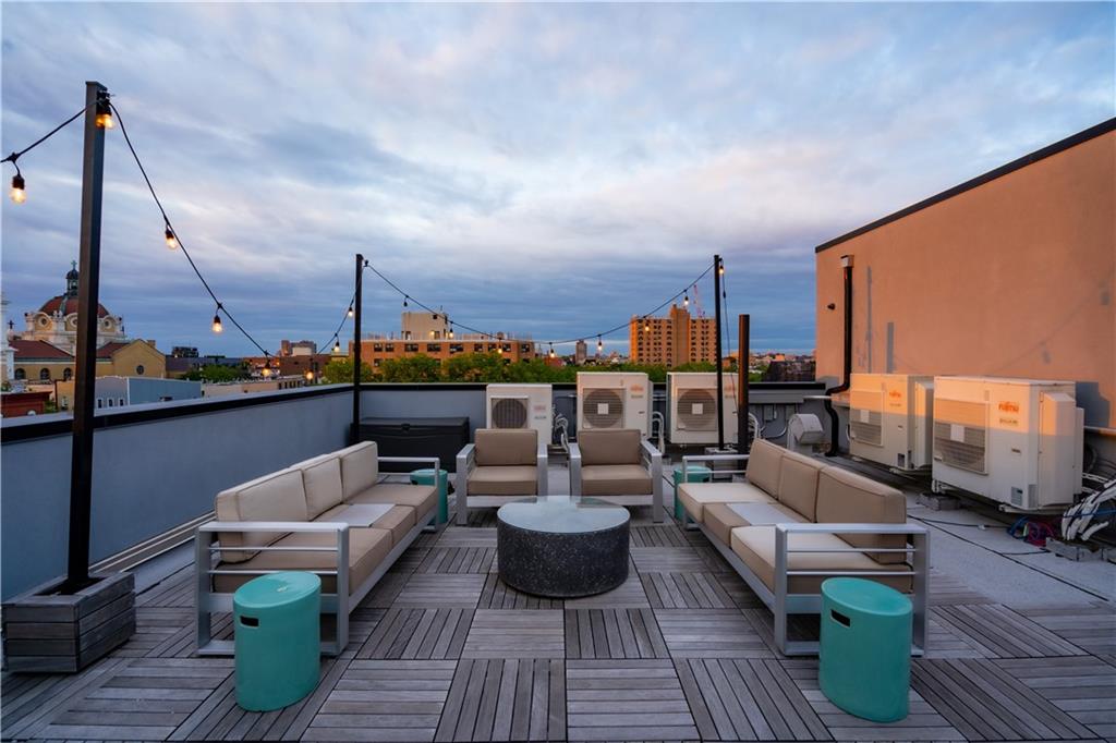 139 Grove Street, Unit 4F Brooklyn, NY 11221 - Photo 22 of 23 a view of a roof deck with couches