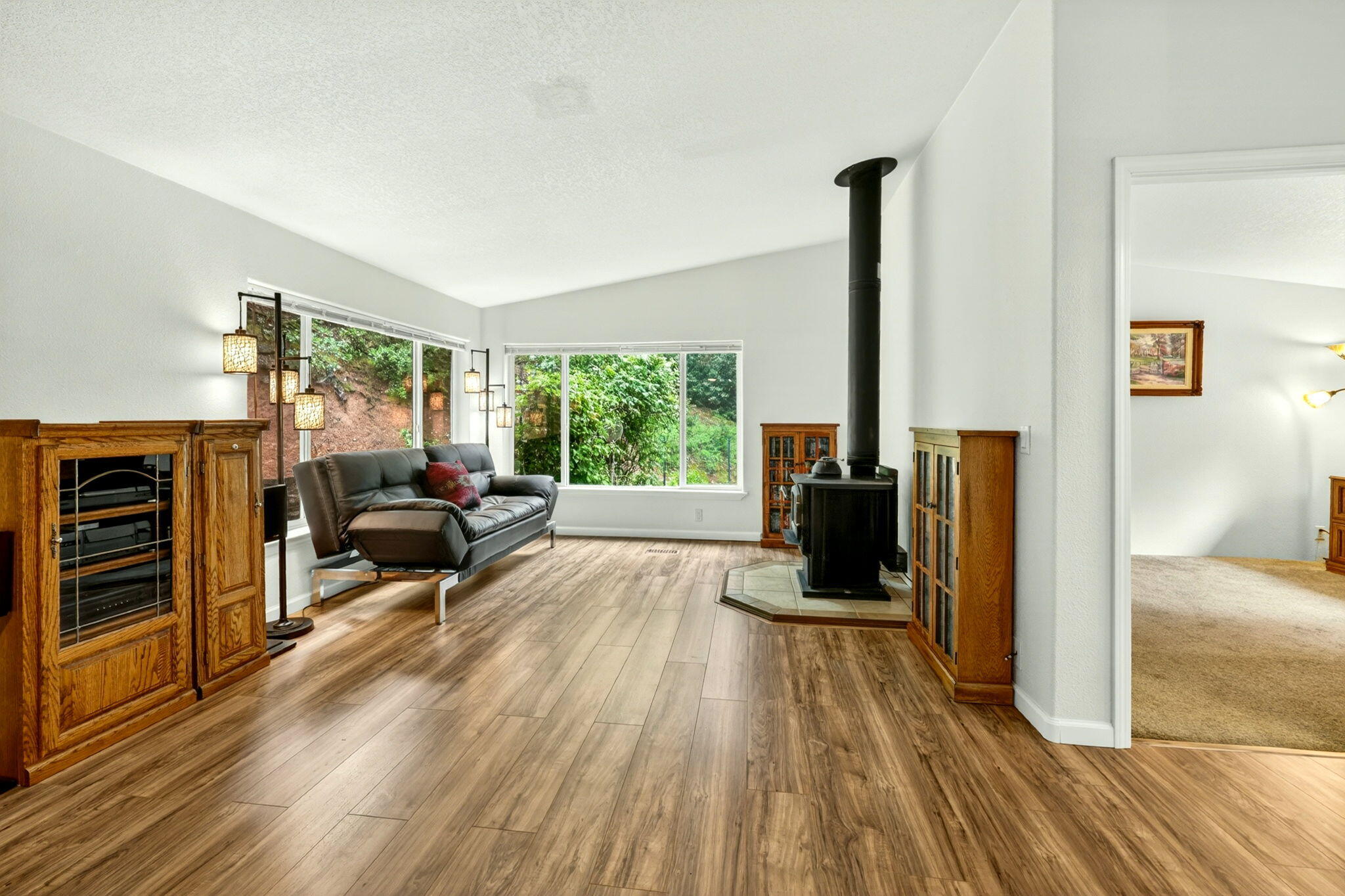 5445 Thompson Creek Road Selma, OR 97538 - Photo 19 of 57 a living room with furniture and a fireplace