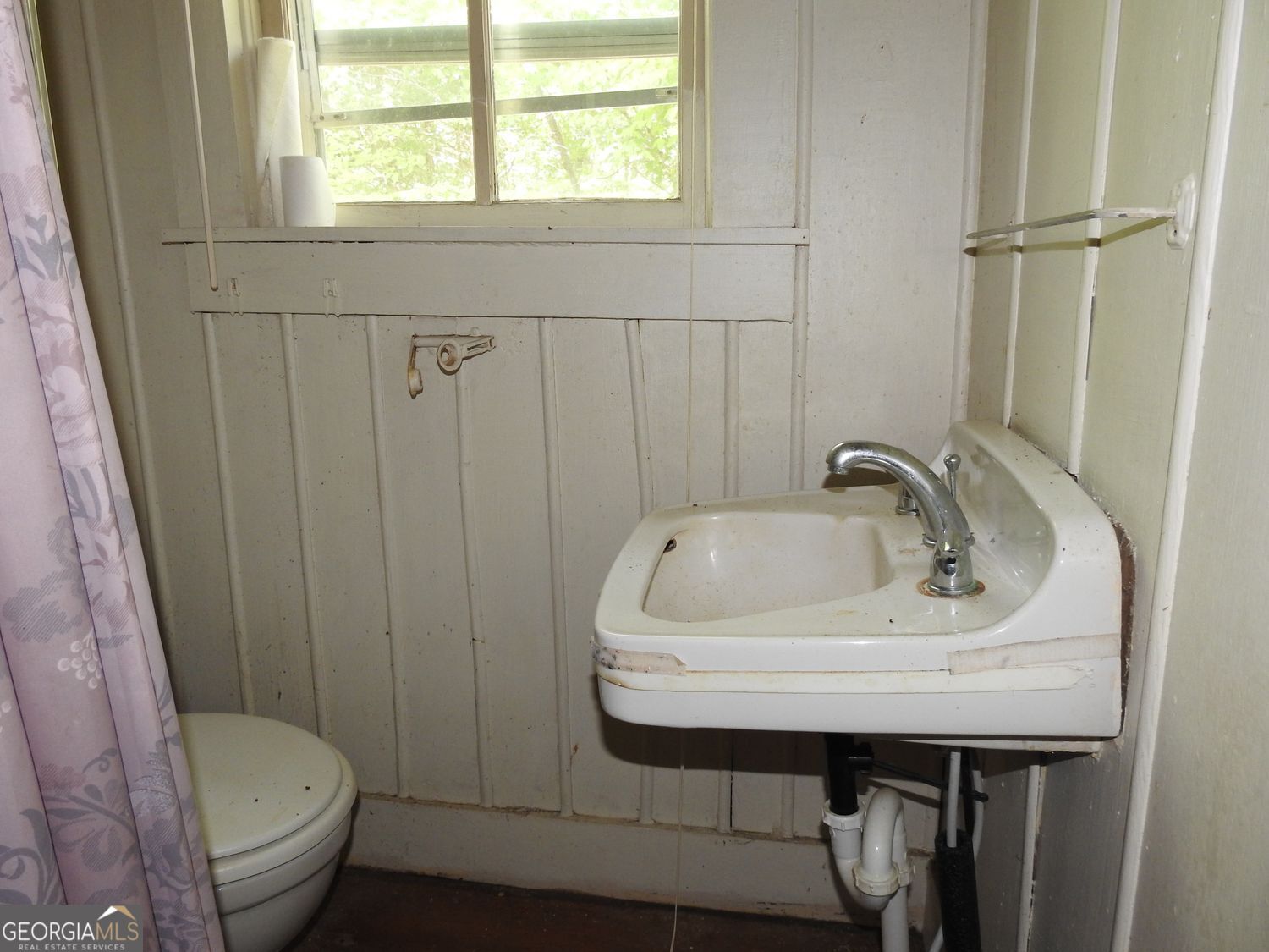 333 Lickskillet Road Epworth, GA 30541 - Photo 27 of 38 a bathroom with a sink a toilet and a mirror