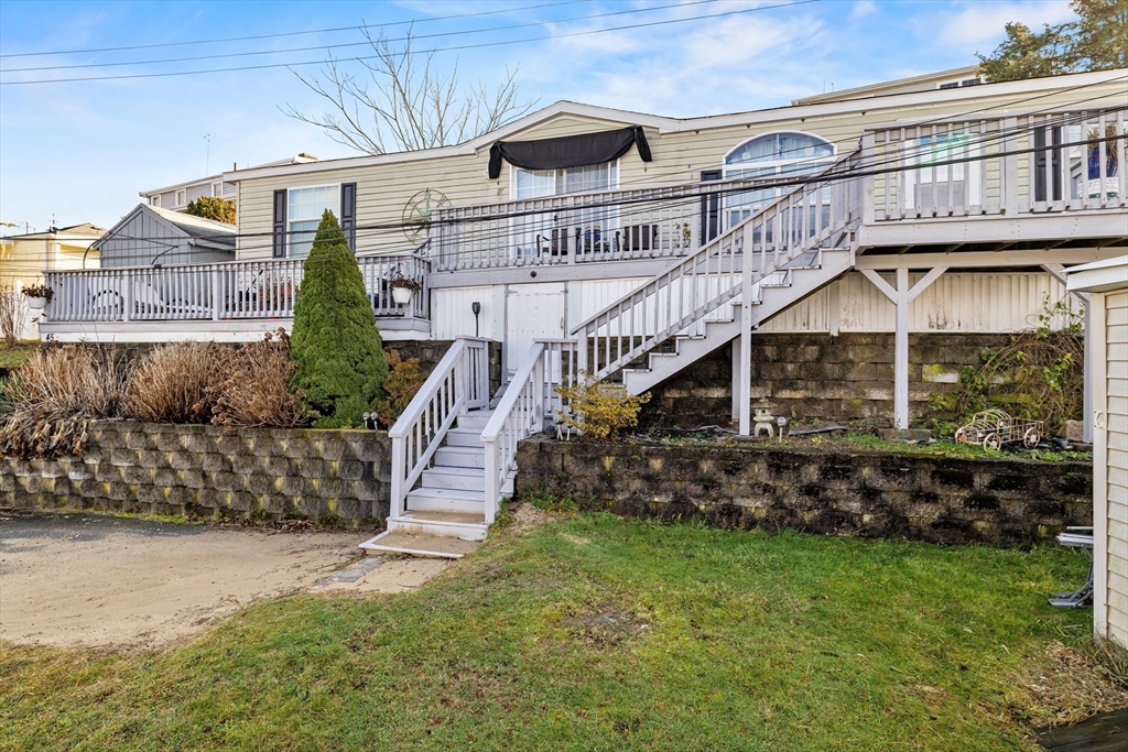 45 Kins Court Wareham, MA 02558 - Photo 1 of 16 a view of a big house with a big yard plants and large trees