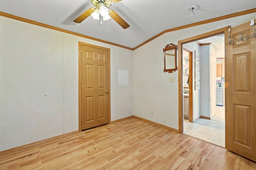 45 Kins Court Wareham, MA 02558 - Photo 10 of 16 a view of empty room with wooden floor and fan