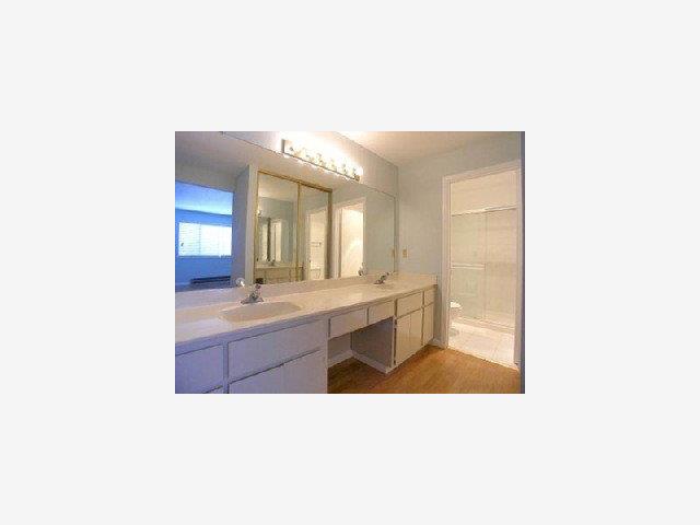 2206 Almaden Road, Unit B San Jose, CA 95125 - Photo 5 of 6 a bathroom with a sink a mirror and a bathtub