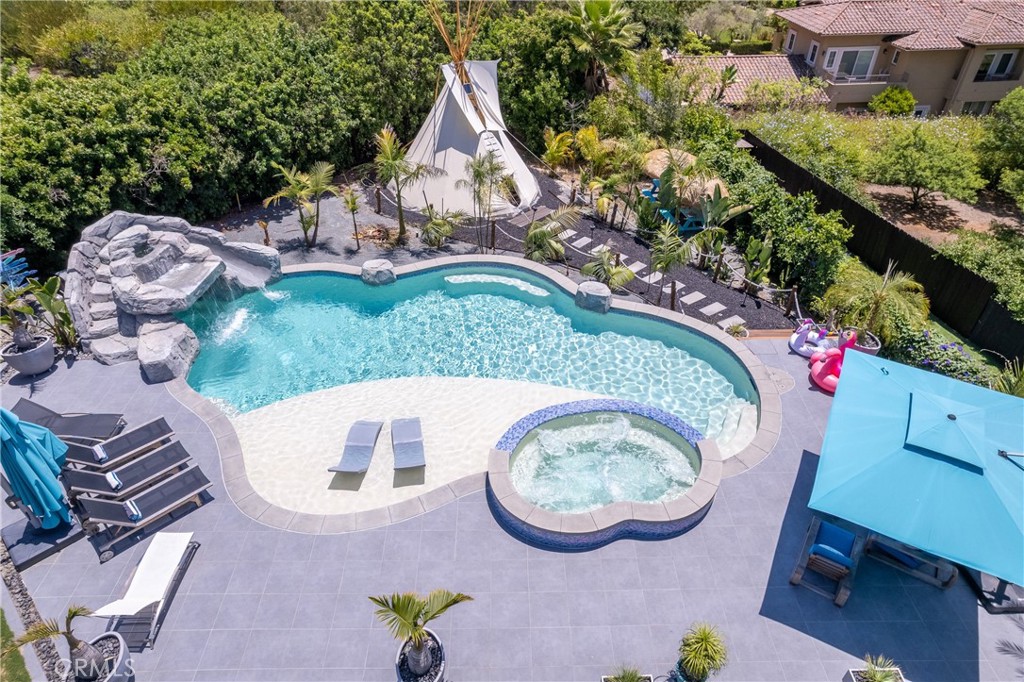 7337 La Soldadera Rancho Santa Fe, CA 92067 - Photo 38 of 60 an aerial view of a house with garden space and swimming pool