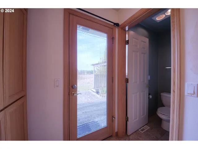 a bathroom with a glass shower door