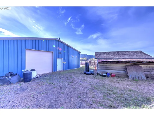 a view of a room with a table and chairs