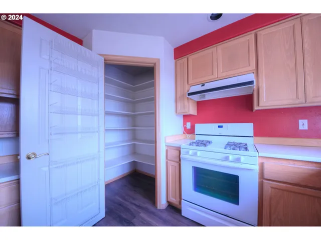 a kitchen with a stove and cabinets