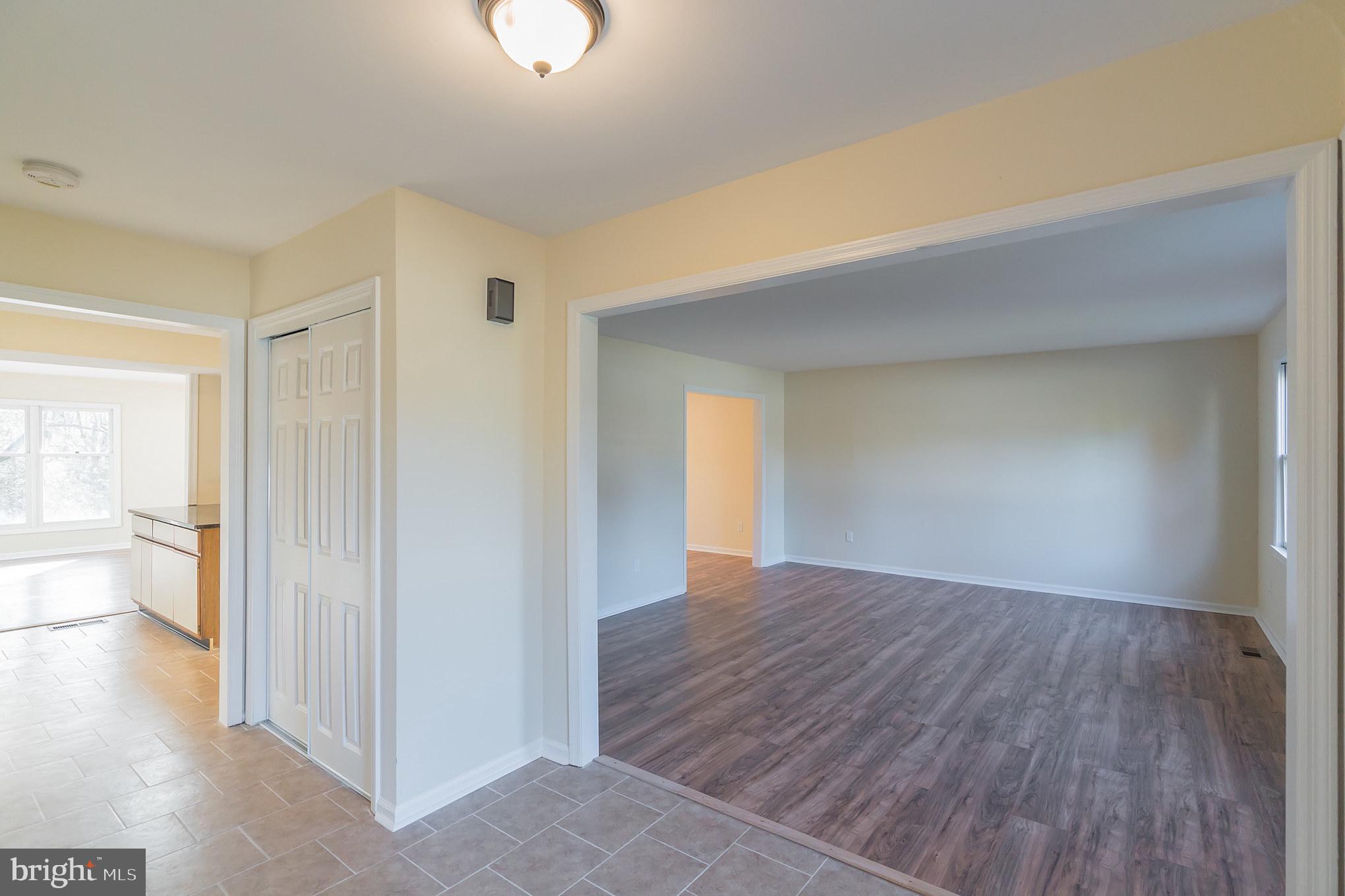 414 Windsor Circle Exton, PA 19341 - Photo 14 of 28 an empty room with wooden floor and windows