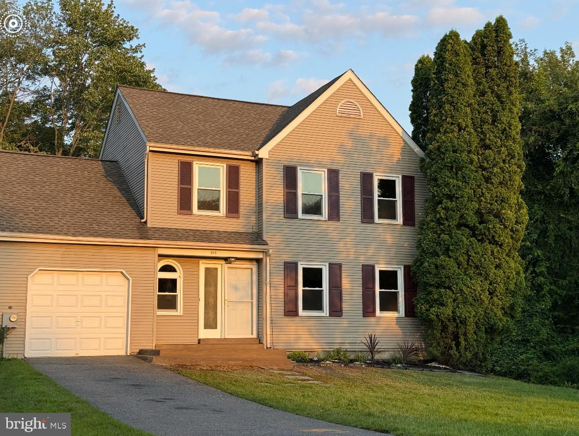414 Windsor Circle Exton, PA 19341 - Photo 2 of 28 a front view of a house with a yard