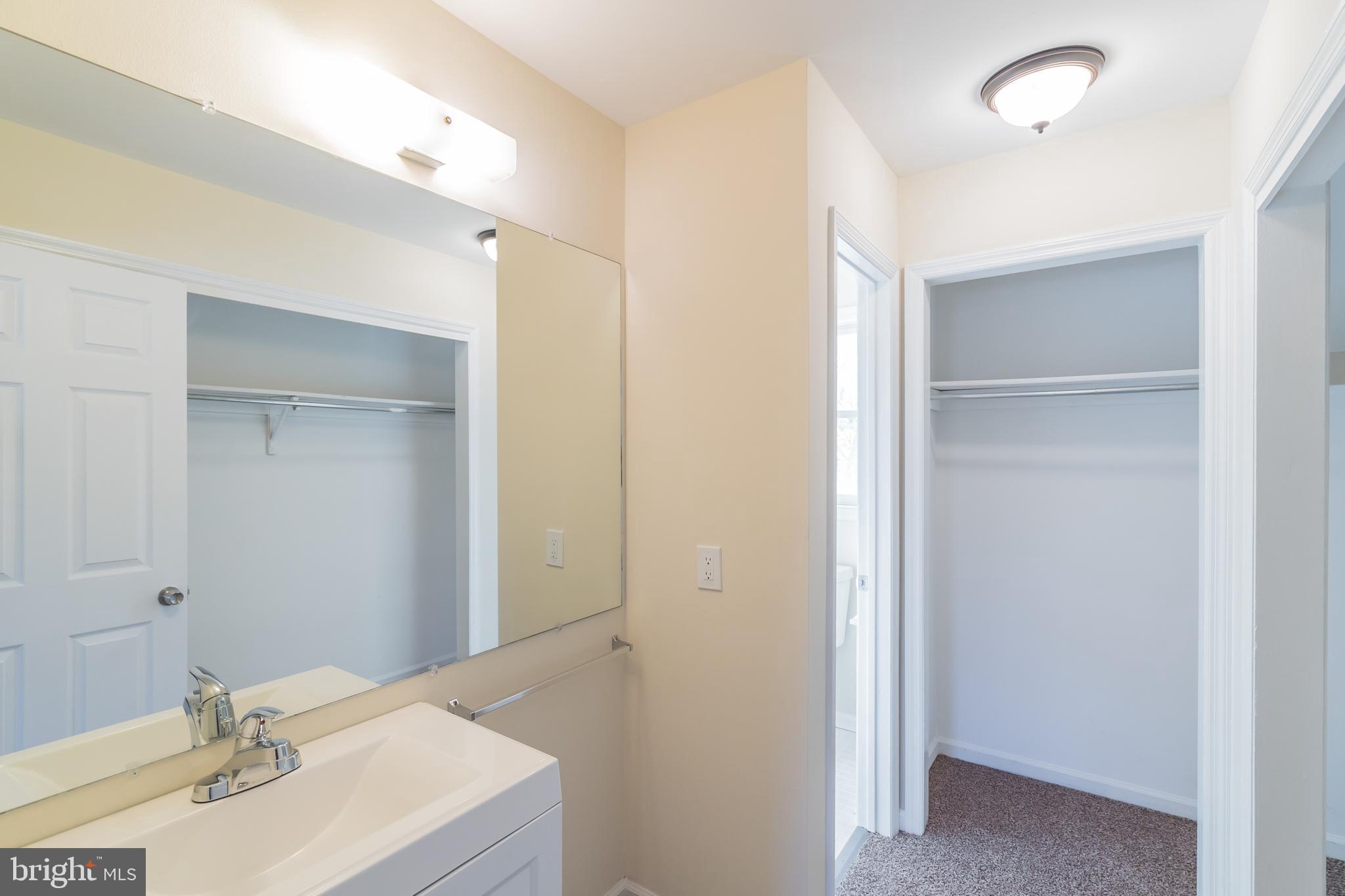 414 Windsor Circle Exton, PA 19341 - Photo 25 of 28 a bathroom with a sink vanity and a mirror