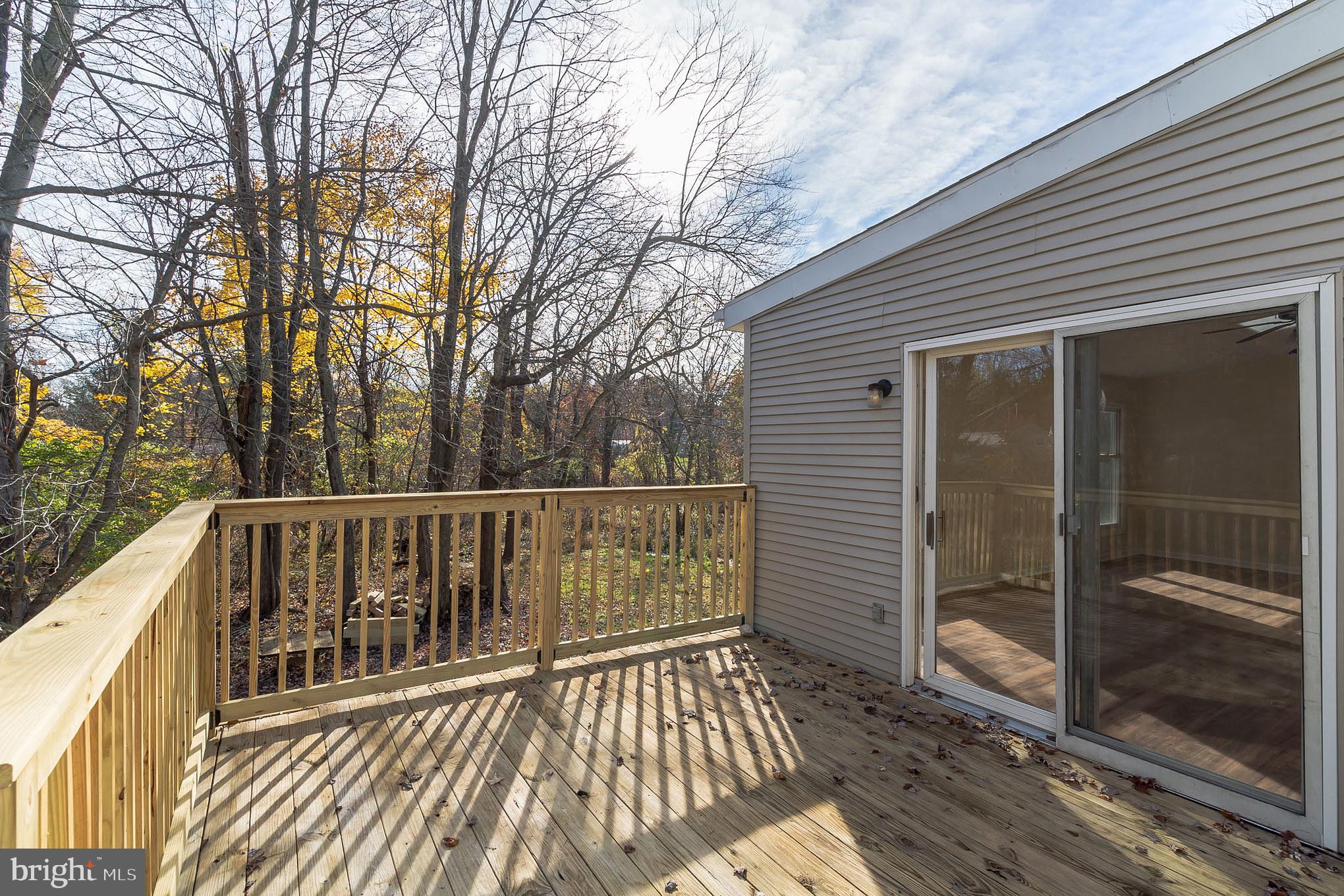 414 Windsor Circle Exton, PA 19341 - Photo 3 of 28 a view of balcony with wooden floor and fence