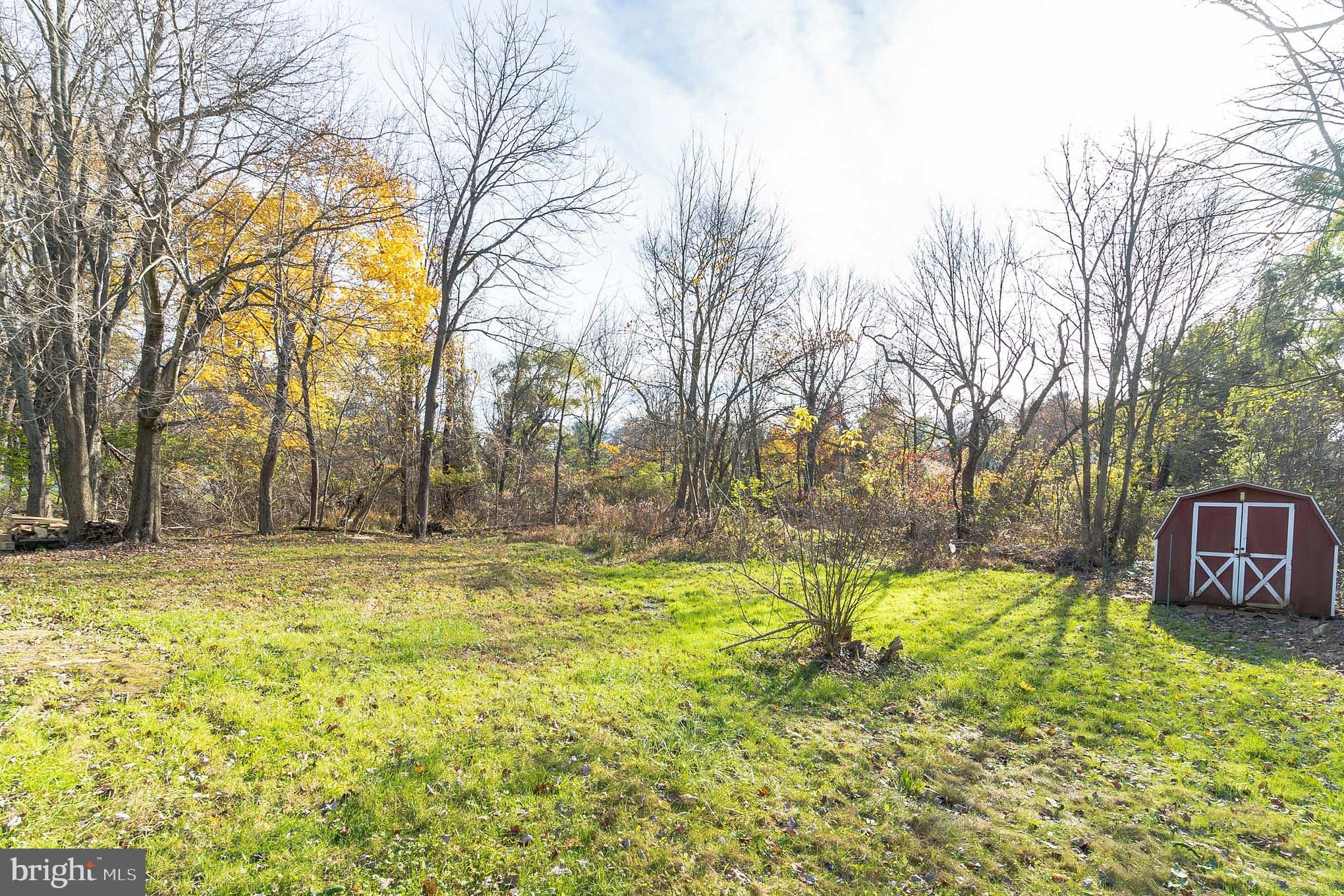 414 Windsor Circle Exton, PA 19341 - Photo 4 of 28 a view of swimming pool with trees and wooden fence