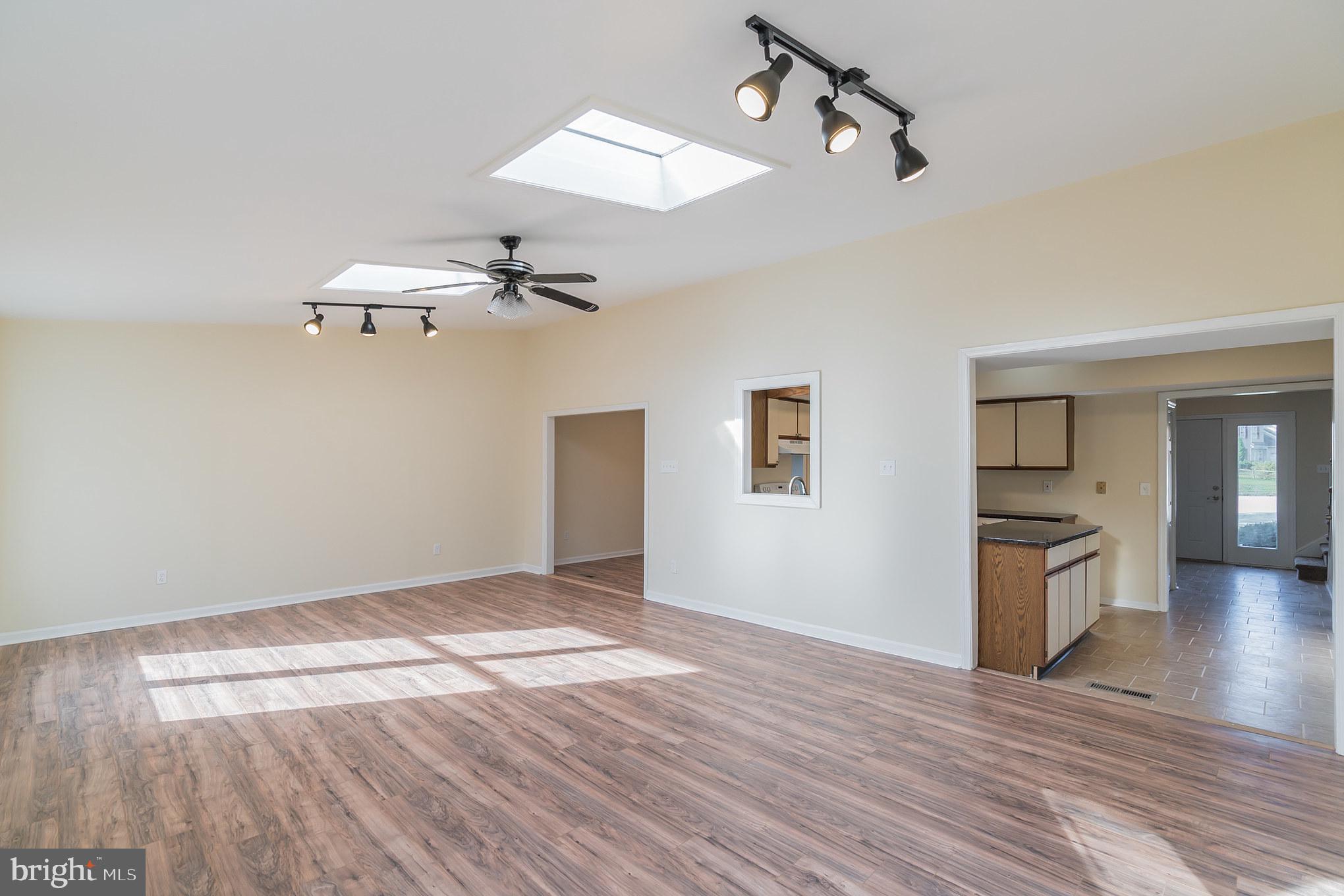 414 Windsor Circle Exton, PA 19341 - Photo 6 of 28 wooden floor in an empty room with a window