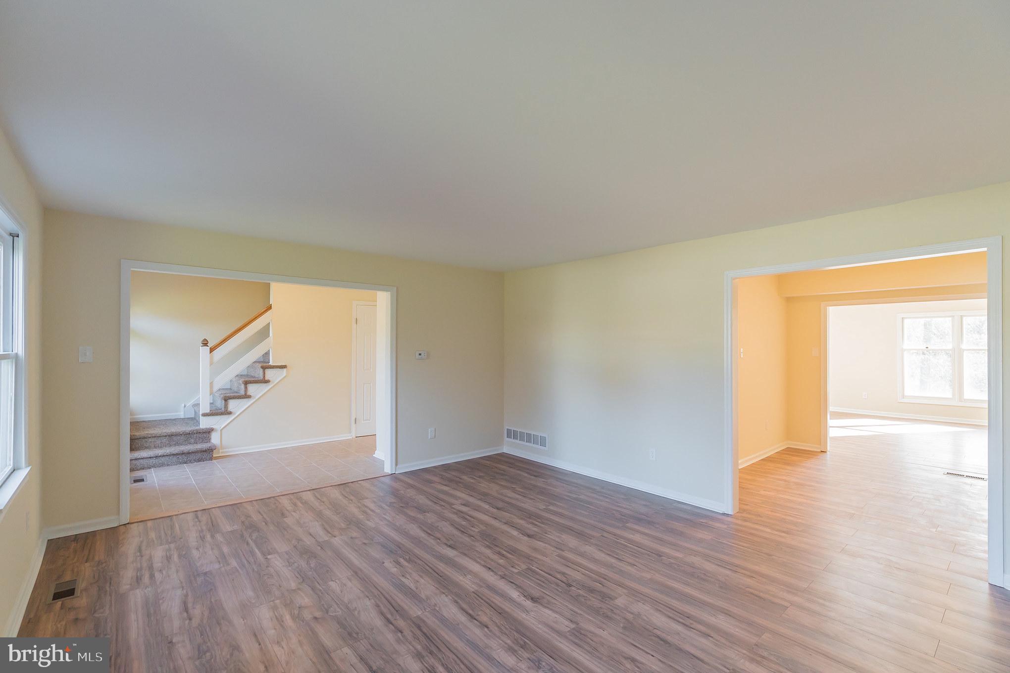 414 Windsor Circle Exton, PA 19341 - Photo 8 of 28 a view of empty room with wooden floor and fan