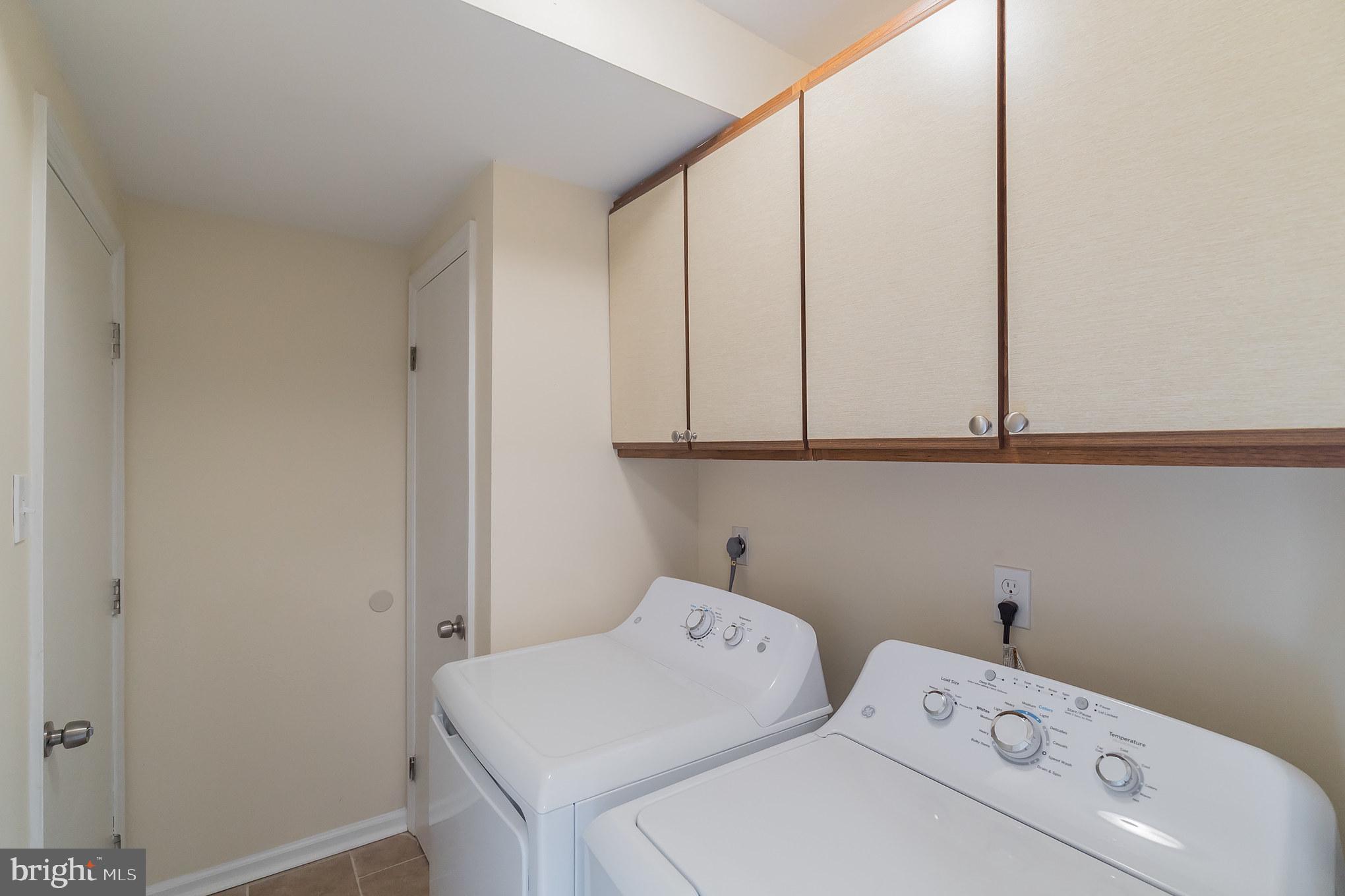 414 Windsor Circle Exton, PA 19341 - Photo 9 of 28 a utility room with dryer and washer