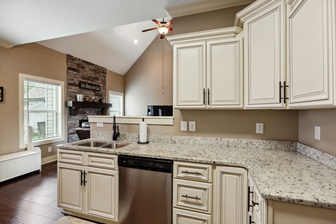 714 Pebble Point Road Lebanon, TN 37087 - Photo 16 of 45 a kitchen with stainless steel appliances granite countertop a sink stove and cabinets