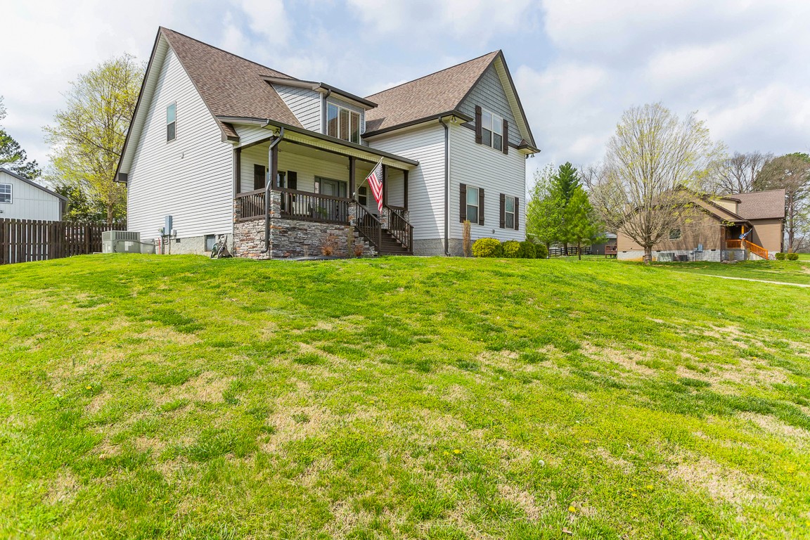 714 Pebble Point Road Lebanon, TN 37087 - Photo 2 of 45 a front view of a house with a garden and yard