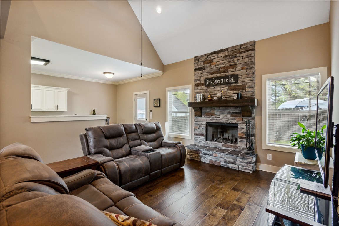 714 Pebble Point Road Lebanon, TN 37087 - Photo 21 of 45 a living room with furniture a fireplace and a potted plant