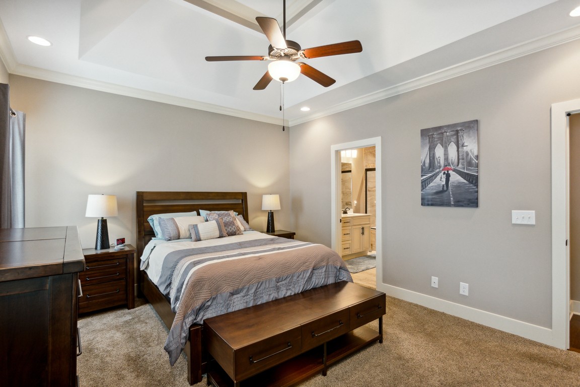 714 Pebble Point Road Lebanon, TN 37087 - Photo 24 of 45 a bedroom with a bed and a chandelier