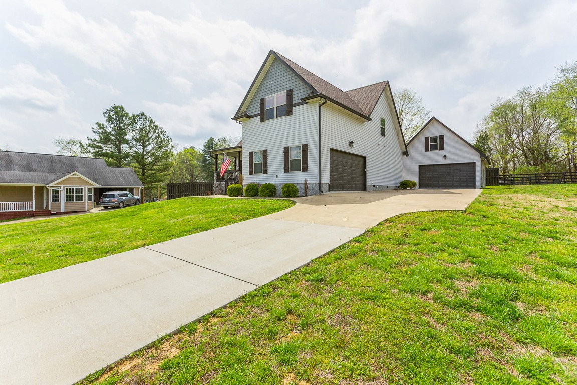 714 Pebble Point Road Lebanon, TN 37087 - Photo 3 of 45 a front view of a house with a yard and garage