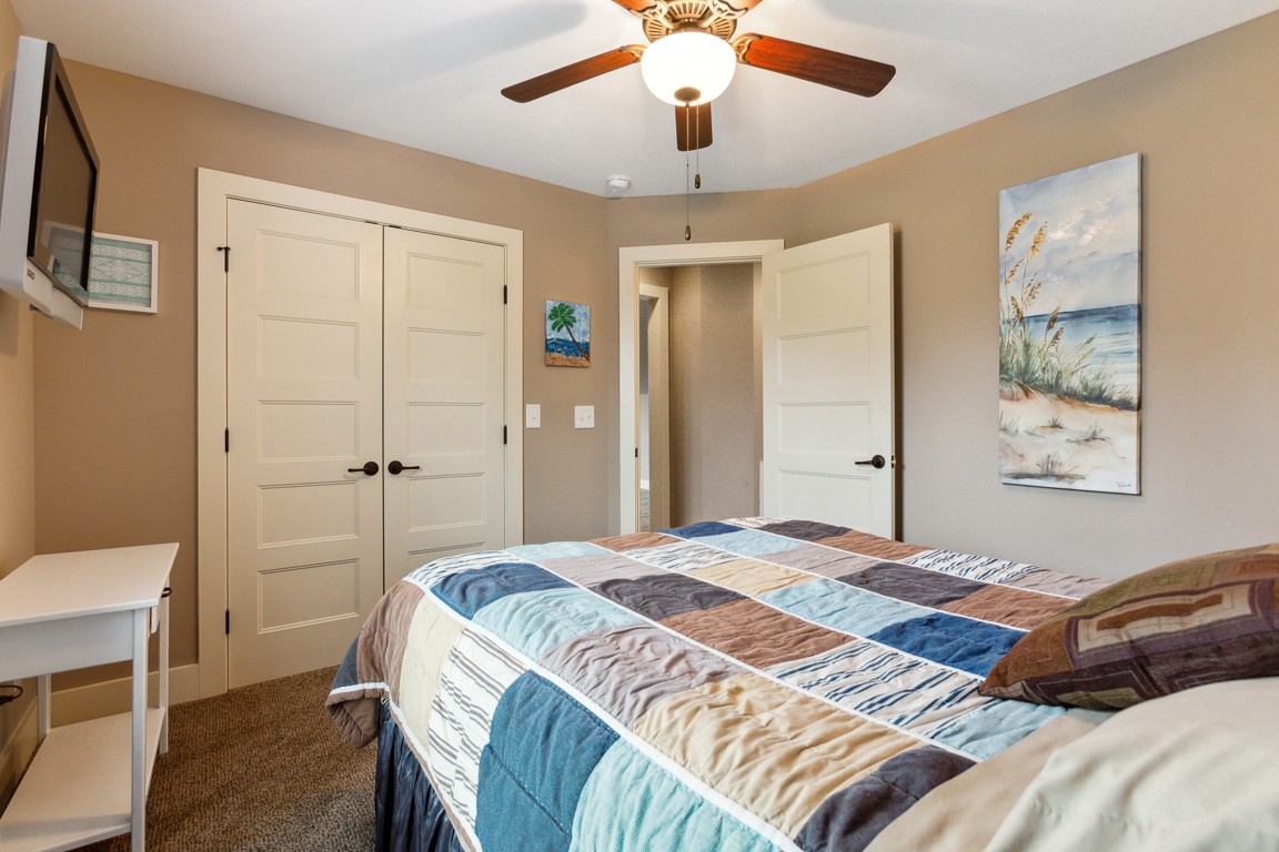 714 Pebble Point Road Lebanon, TN 37087 - Photo 35 of 45 a bedroom with a bed and a chandelier