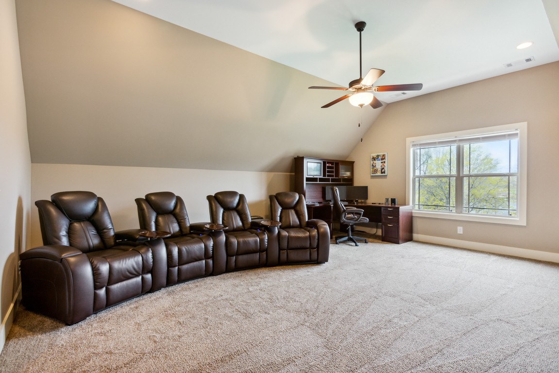 714 Pebble Point Road Lebanon, TN 37087 - Photo 36 of 45 a living room with furniture a chandelier and a window