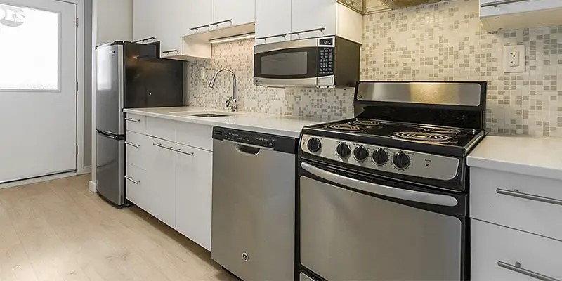 2037 Walnut Street Boulder, CO 80302 - Photo 5 of 13 a kitchen with granite countertop cabinets and steel stainless steel appliances
