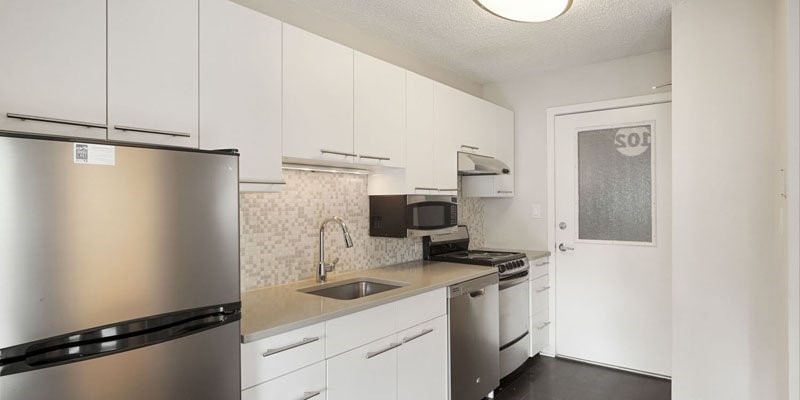 2037 Walnut Street Boulder, CO 80302 - Photo 7 of 13 a kitchen with a refrigerator and a sink