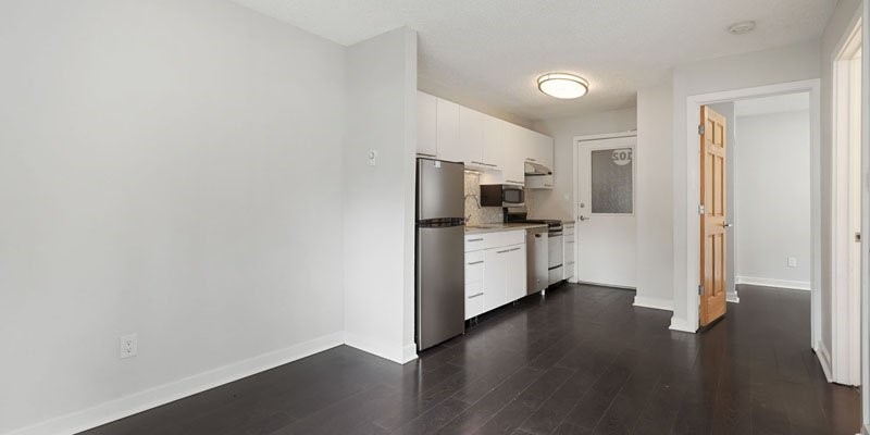 2037 Walnut Street Boulder, CO 80302 - Photo 8 of 13 a kitchen with stainless steel appliances a refrigerator and wooden floor